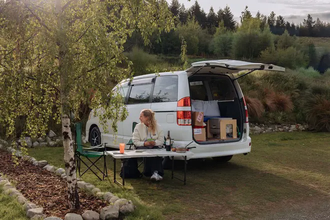 Outdoor dining setup beside a campervan during a New Zealand road trip